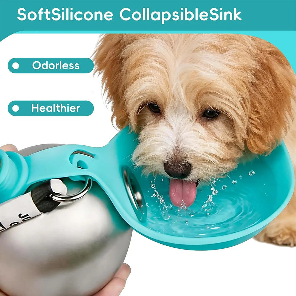 A small fluffy dog is shown drinking water from a turquoise collapsible silicone pet bowl attached to a silver water bottle. The image includes marketing text reading 'SoftSilicone CollapsibleSink', 'Odorless', and 'Healthier'.