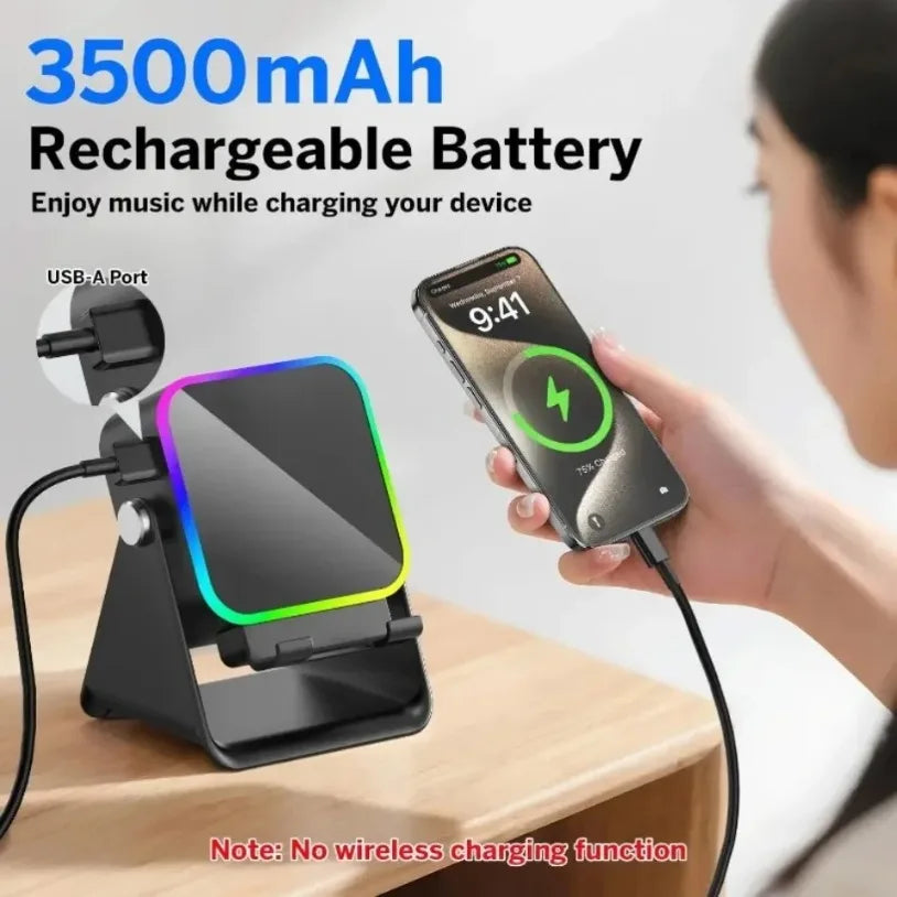 Person using a smartphone with a 3500mAh rechargeable battery pack on a stand.