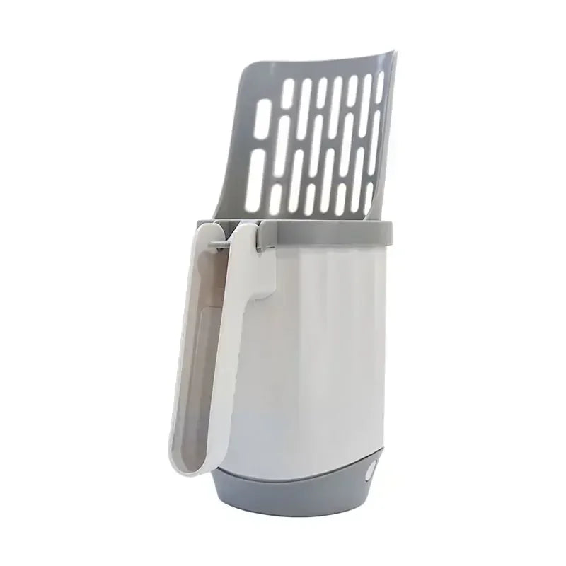 Gray pet litter scoop with perforated design on a white background