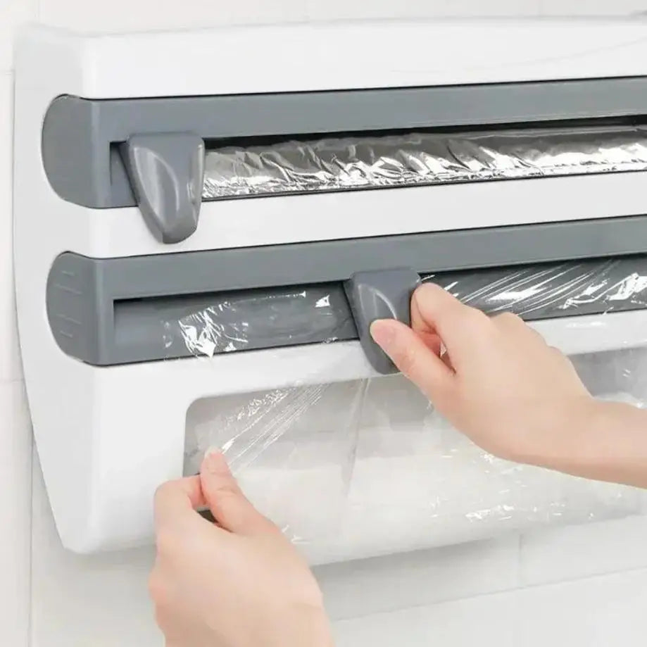 Hands using a plastic wrap holder on a refrigerator.