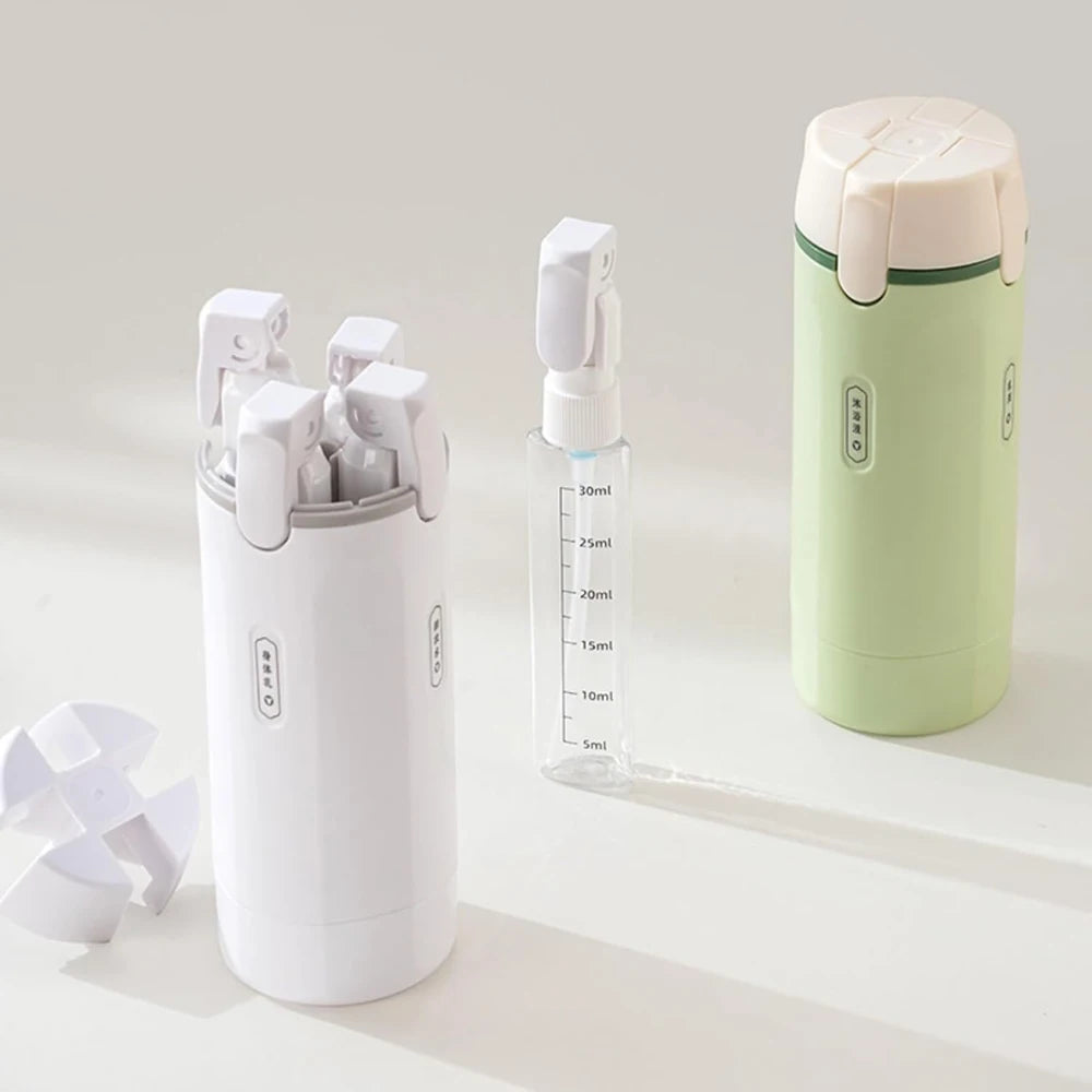 Set of skincare tools including a white container with applicators, a clear bottle with measurement markings, and a green and white travel-sized product on a light background.